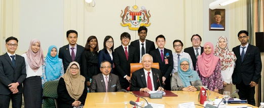 Prime Minister Datuk Seri Najib Razak with 14 JPA scholars under the Scholarship Talent Attraction and Retention (STAR) initiative managed by TalentCorp.