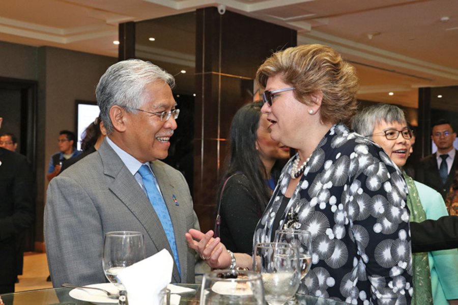 Idris Jusoh and  Sarah Deverall sharing a light moment.