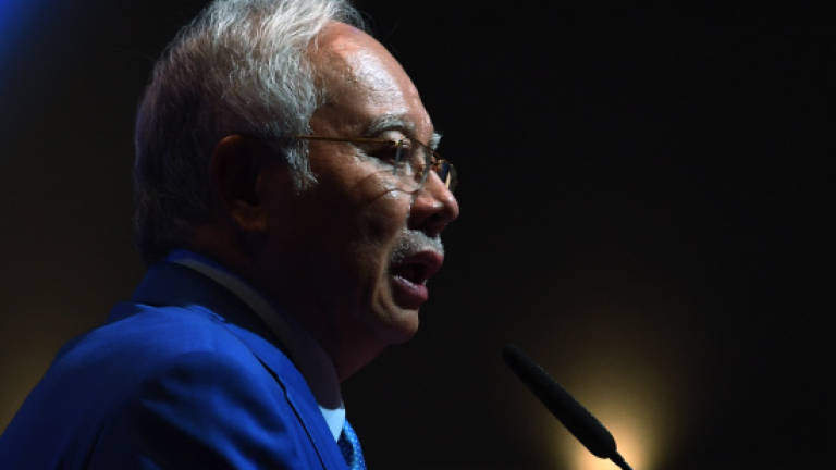 Prime Minister Datuk Seri Najib Abdul Razak delivers a speech at the 'InvestKL Annual Ministerial Event' 2018 at the Malaysia International Trade and Exhibition Center (MITEC) on March 29, 2018. — Bernama