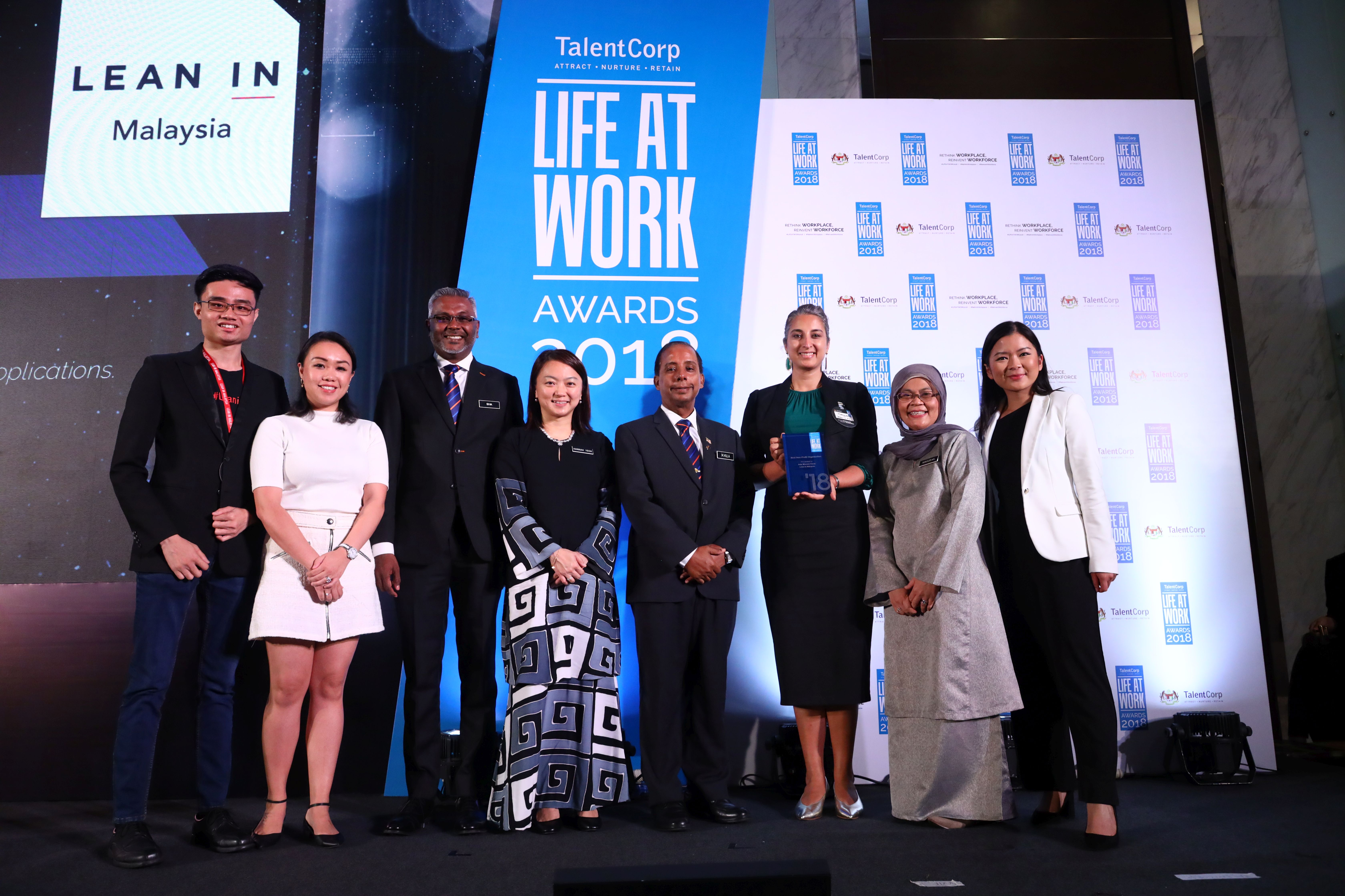  YB Hannah Yeoh at the LIFE AT WORK 2018 Awards. In a special message, Deputy Minister of Women, Family and Community Development YB Hannah Yeoh talks about the importance of having healthy and safe workplaces.   This is a time of reckoning for Malaysia. We are making that difficult shift from developing nation to developed nation. Our families are facing the seemingly impossible challenge of juggling increased living costs, and their desire to grow safe and happy families.  To further complicate matters, our existing workplace culture rewards long hours, appreciating output over outcomes. This makes it difficult for our citizens, whether men or women, young or old, single or married, to fulfil demands of work, family and life at the same time.    The recently announced Budget 2019’s allocation of RM10 million to the Ministry of Women, Family and Community Development towards building 50 childcare facilities in civic buildings is just a first step. This move is a small milestone and we hope it will go a long way towards stopping abuse cases caused by childminders.    As parents ourselves, we are at peace when our children are near us, safe with well-trained childcare providers. When we have peace, we work better, we are happier. And happy families make a happy and productive country.   Of course, this New Malaysia with satisfied, productive citizens will not happen overnight. Together with the Ministry of Human Resources, my ministry will continue to grow and expand the impact of TalentCorp’s annual LIFE AT WORK Awards. This is the Government’s way of appreciating and celebrating progressive companies who are committed to embracing work-life practices for the benefit and wellbeing of their employees.   I look forward to seeing more organisations in both the public and private sector stepping up to offer their employees the long-due support systems.